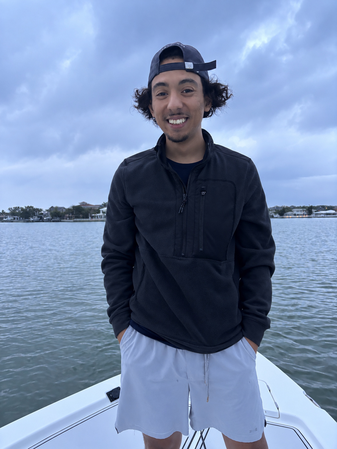 Michael Toro standing on a boat in Tampa Bay